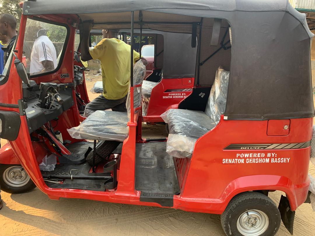 SEN. GERSHOM BASSEY DELIVERS TRICYCLES TO CONSTITUENTS IN THE SPIRIT OF YULETIDE.